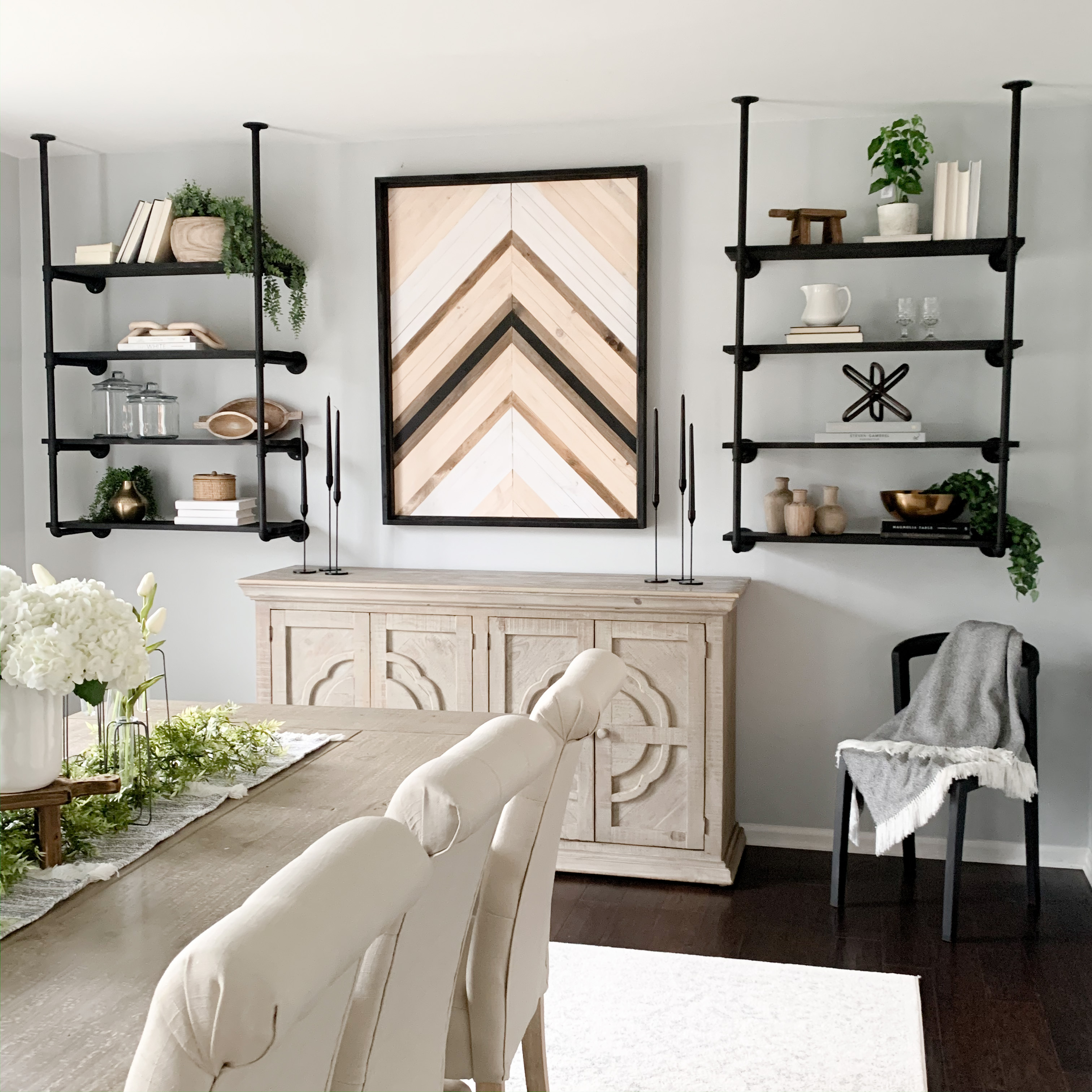 Dining room decorated with decor and art.