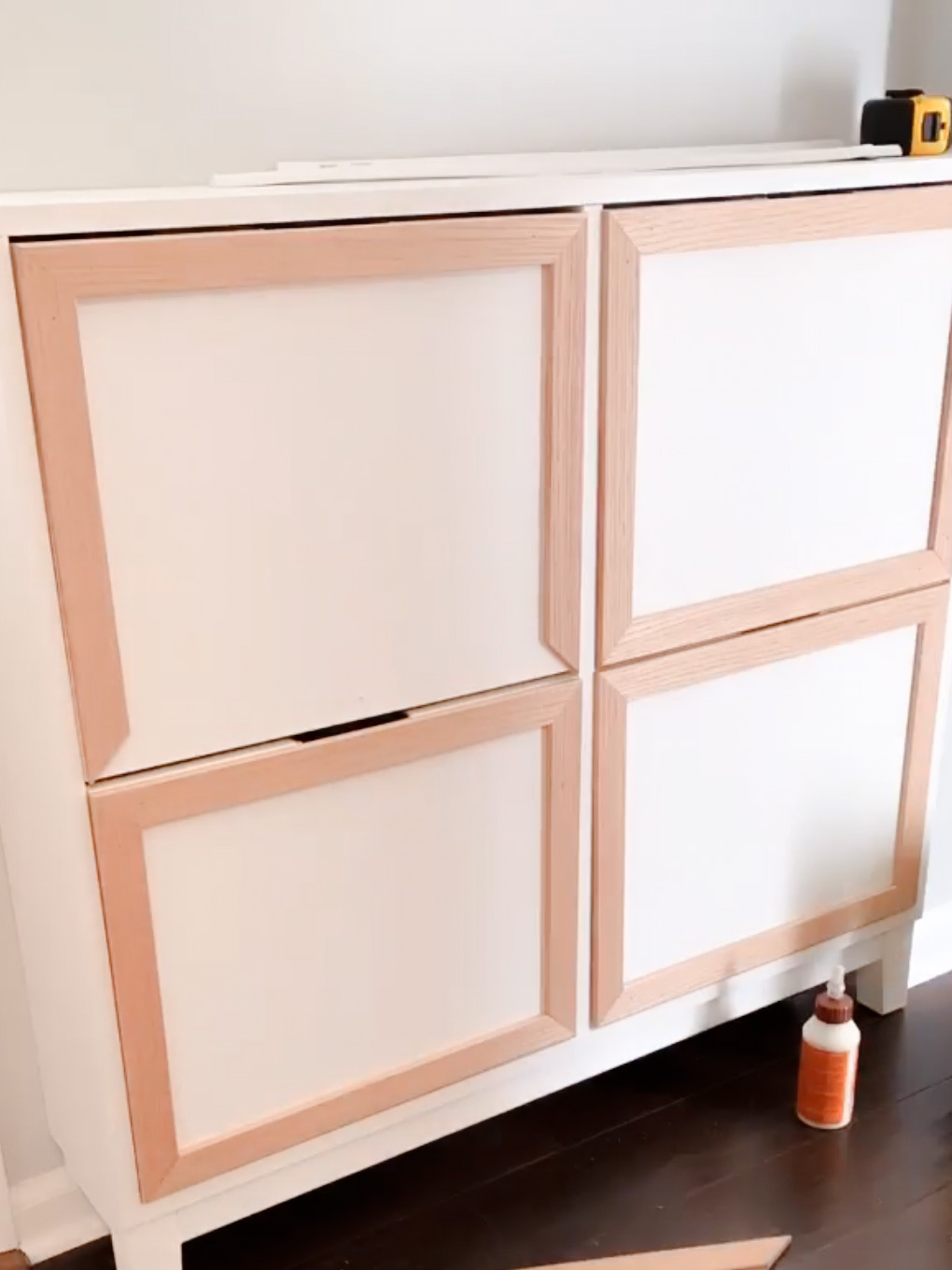 Shoe cabinet with edges of the drawers framed out.