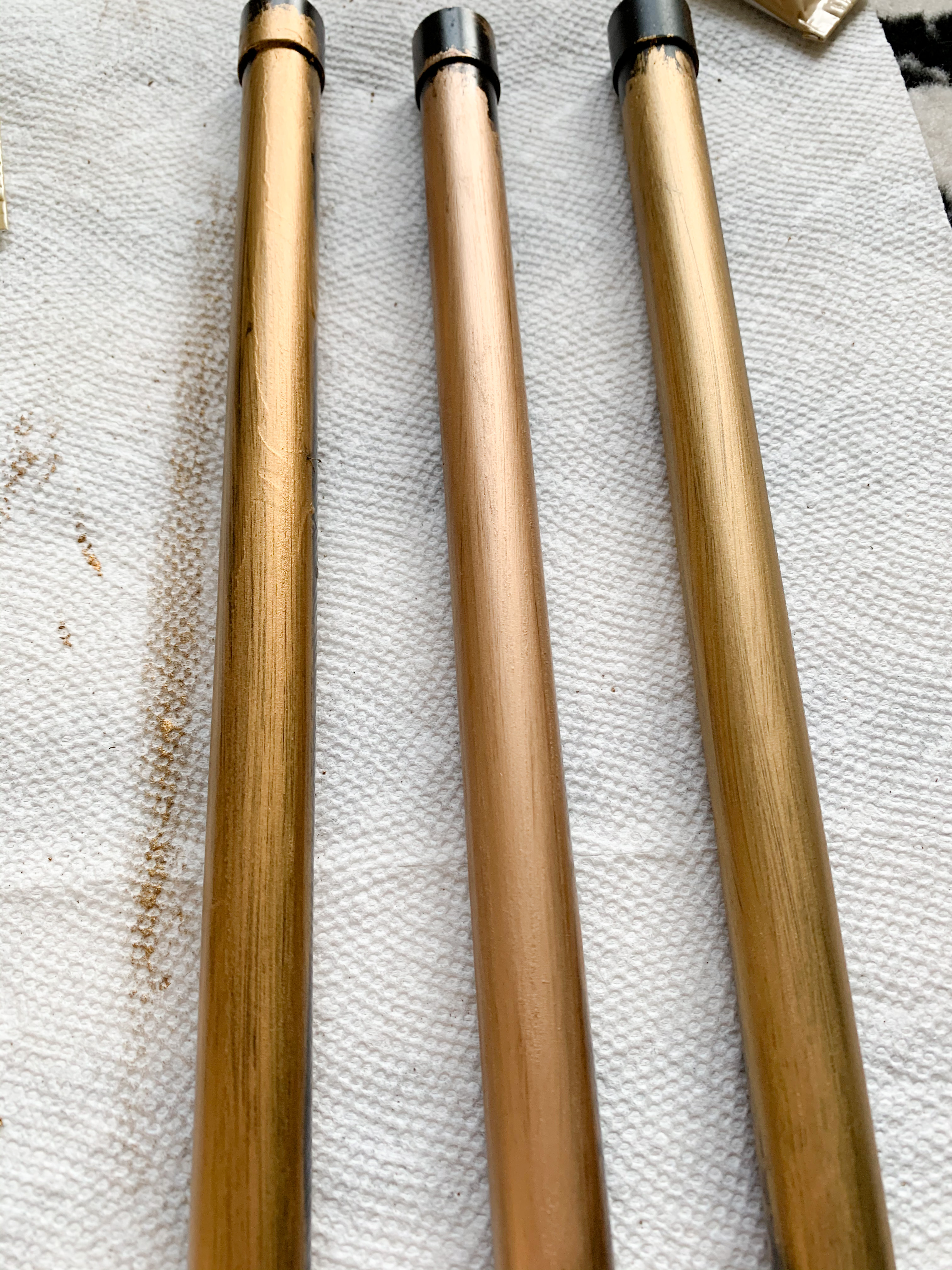 Copper pipes with different rub-n-buff colors.