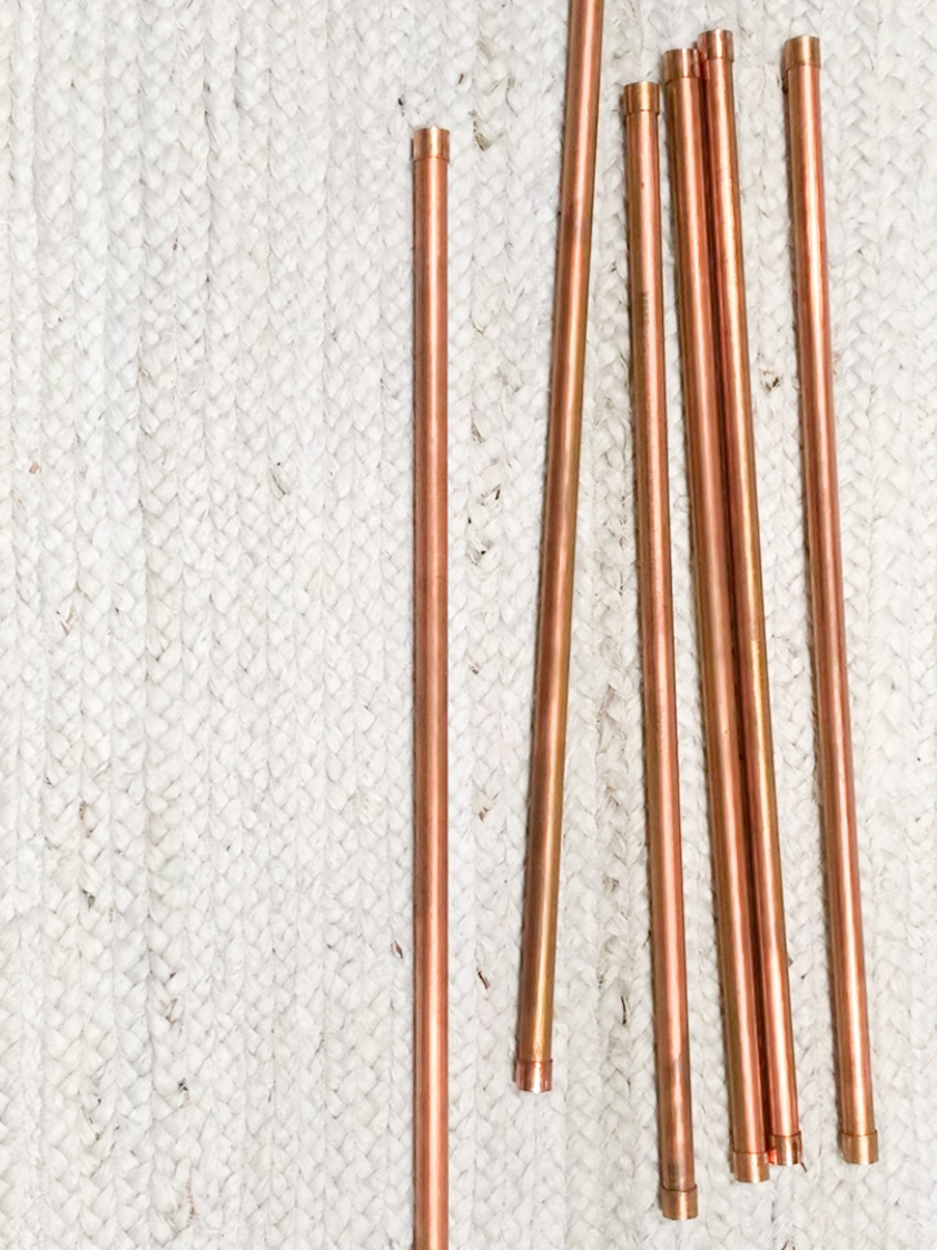 Short lengths of capped copper pipes.