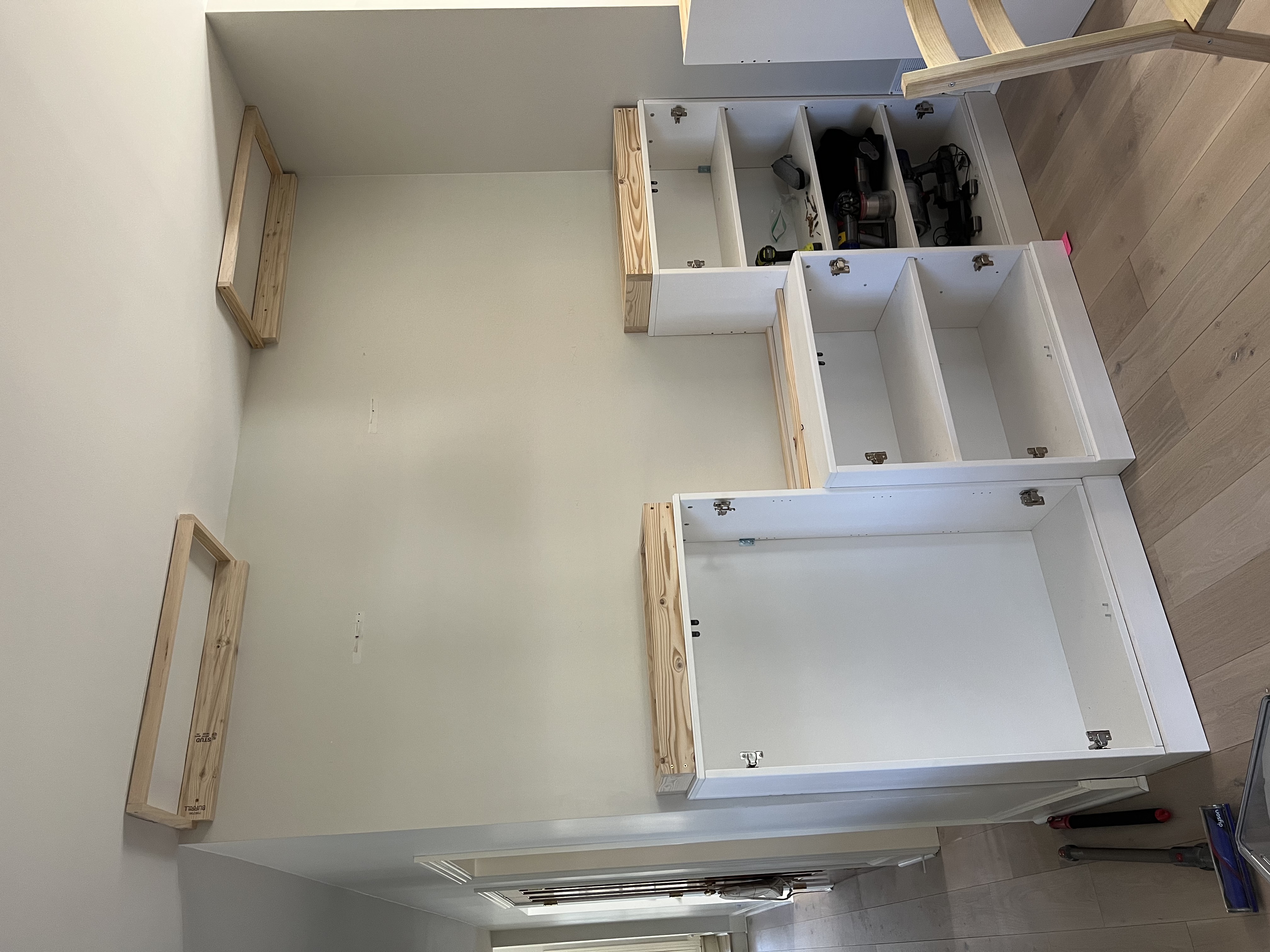 Boxes attached to top of cabinets and to the ceiling.