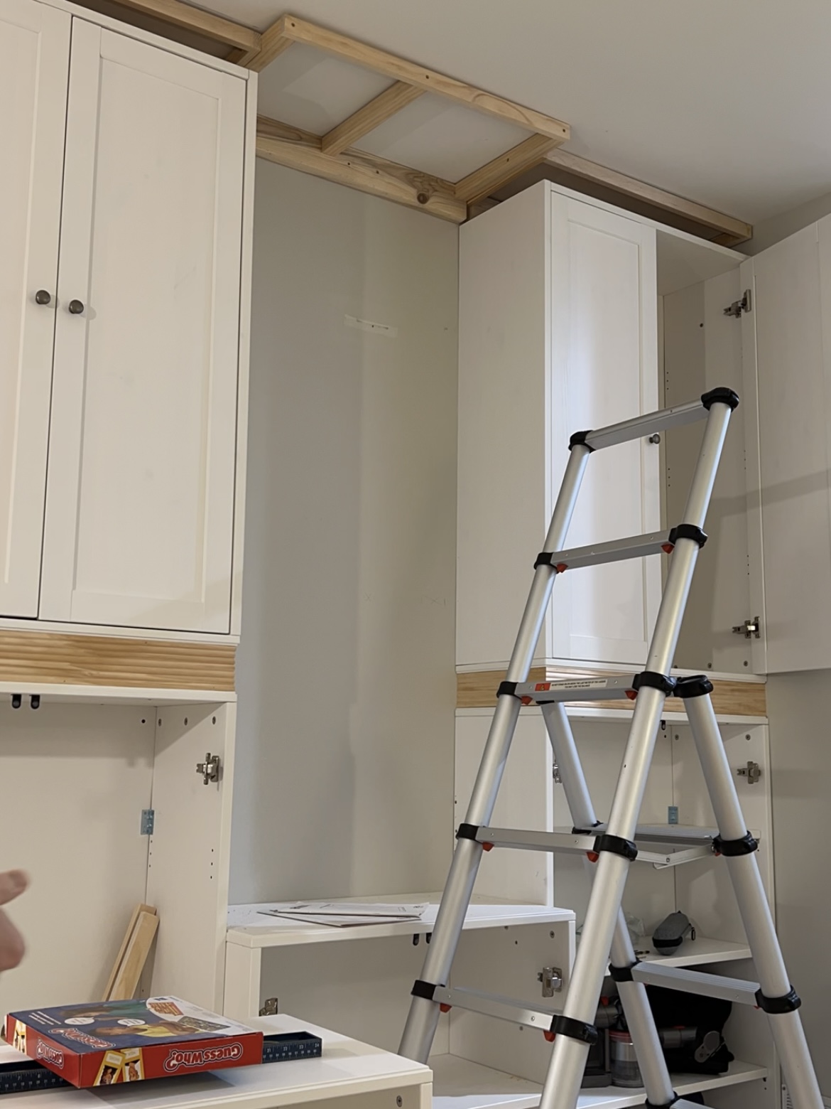 Attaching cabinets together.