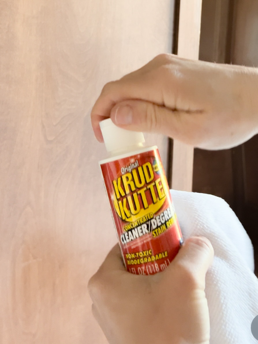 Holding Krud Kutter - an important part of how to paint cabinets.