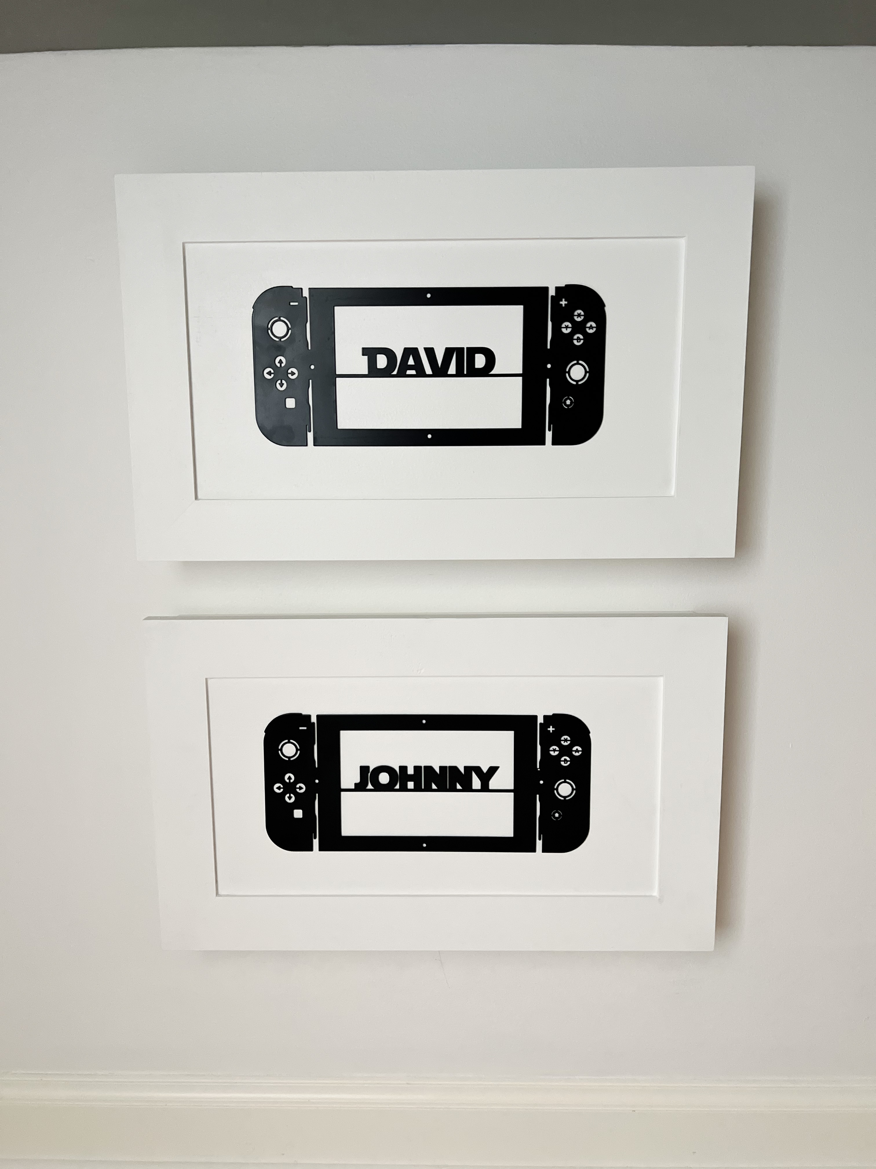 Lego cabinets closed - sowing video game controllers personalized with names.