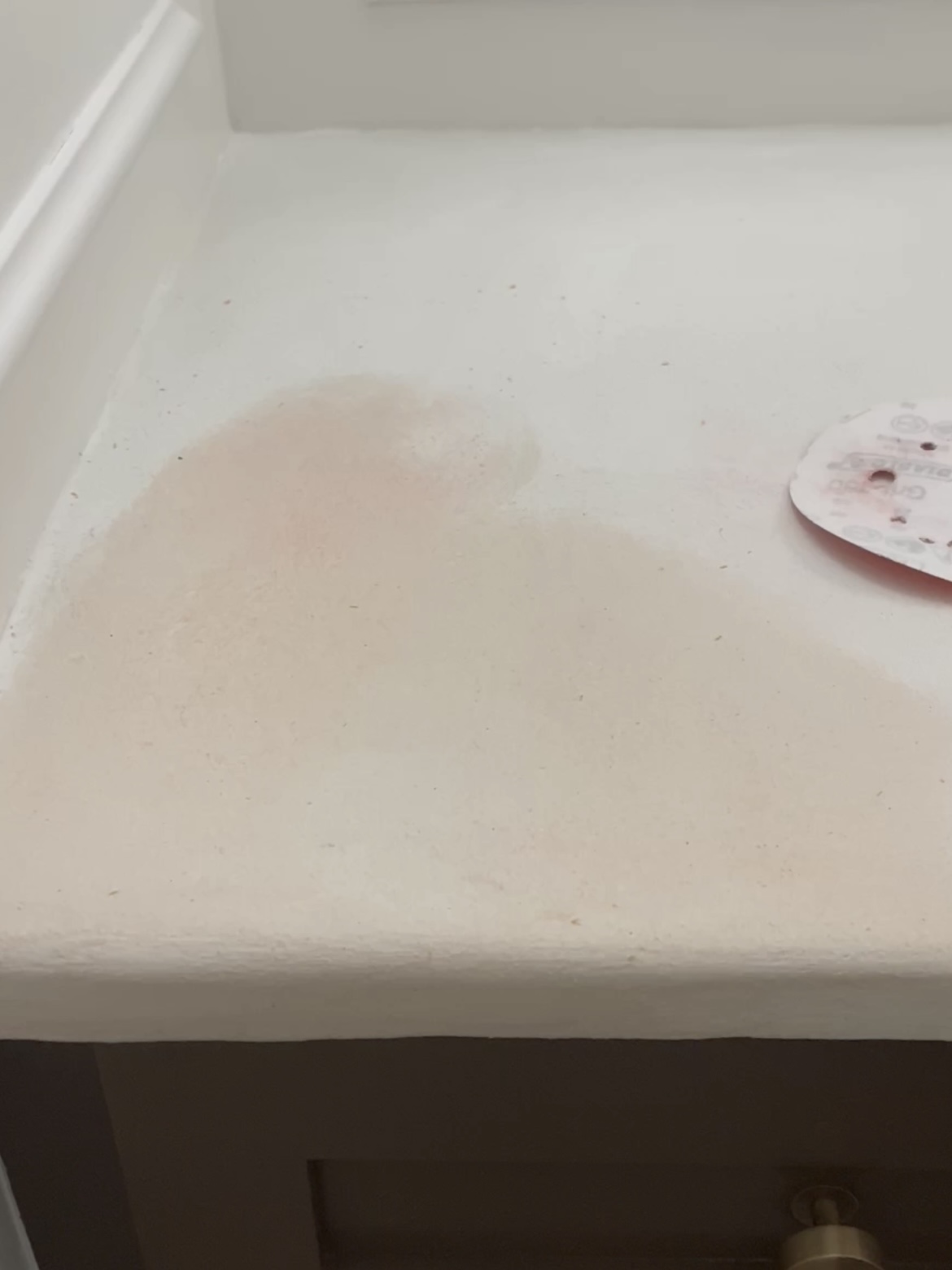 Image showing a stain on a faux cement countertop from a sanding pad.