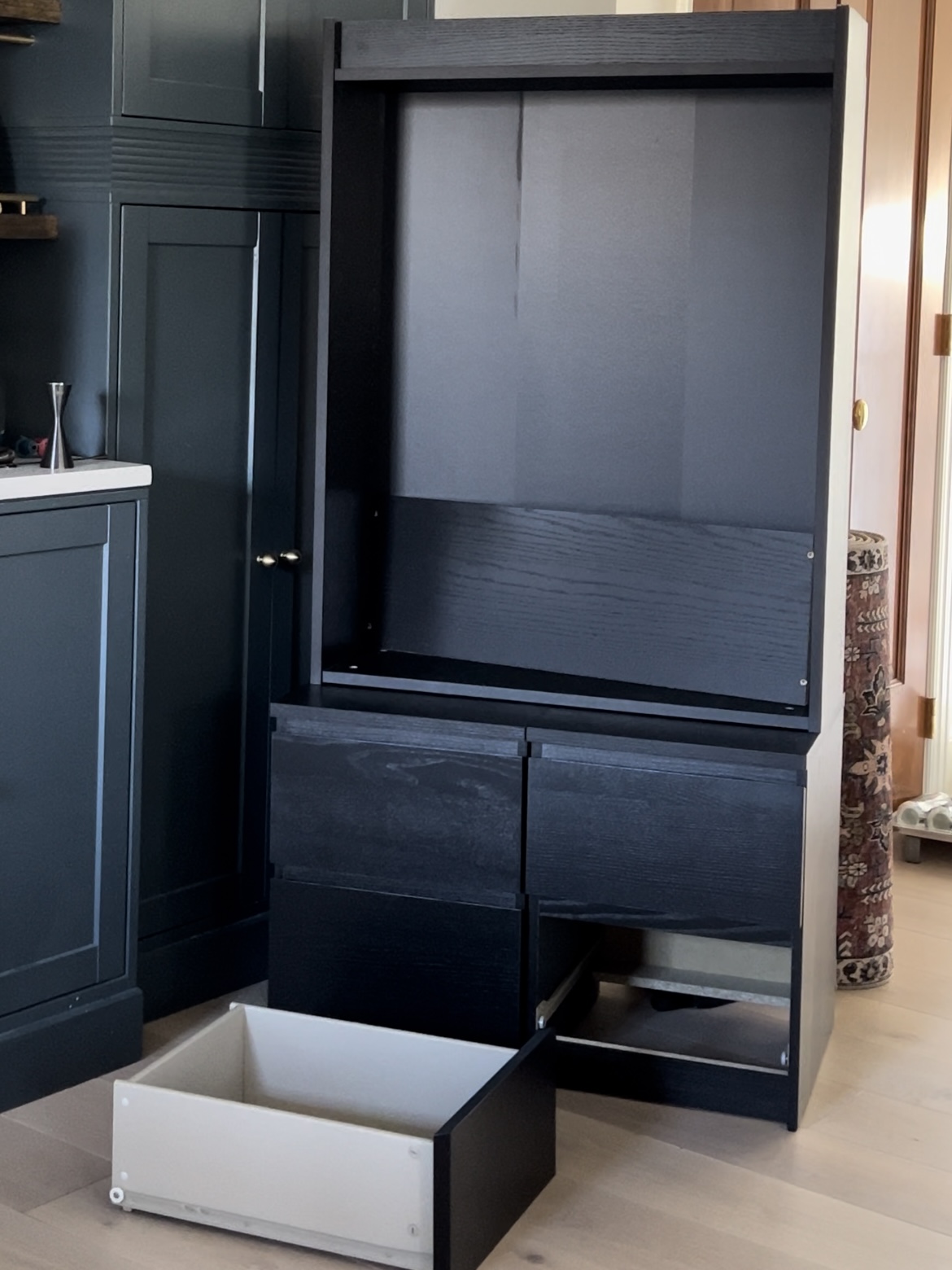 Two IKEA malm nightstands and a billy bookcase in the color black-brown.