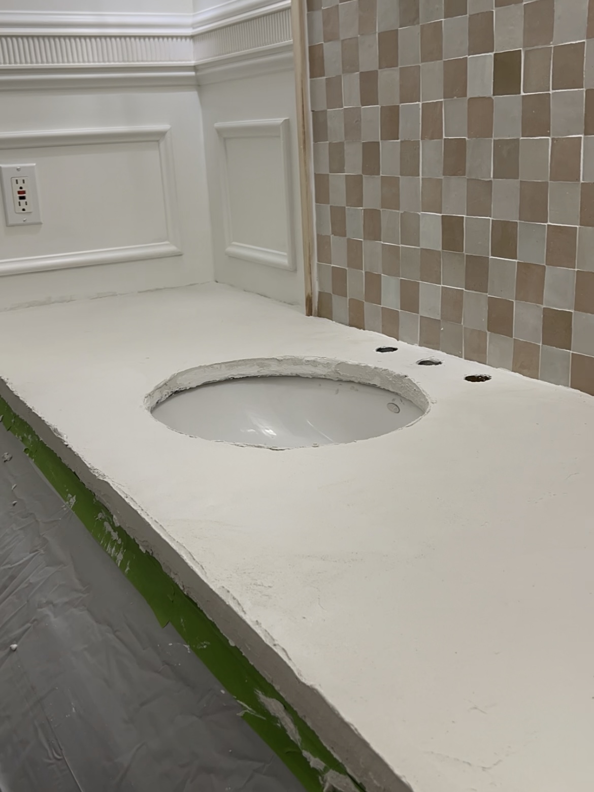 Fresh coat of faux cement on bathroom countertop.