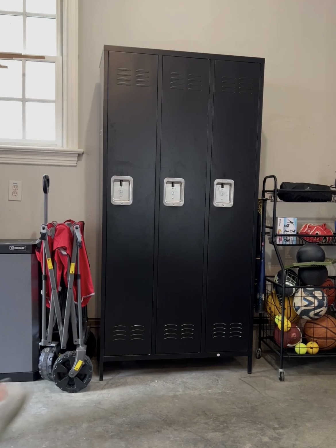 Photo of a locker cabinet that has a set of three individual lockers.