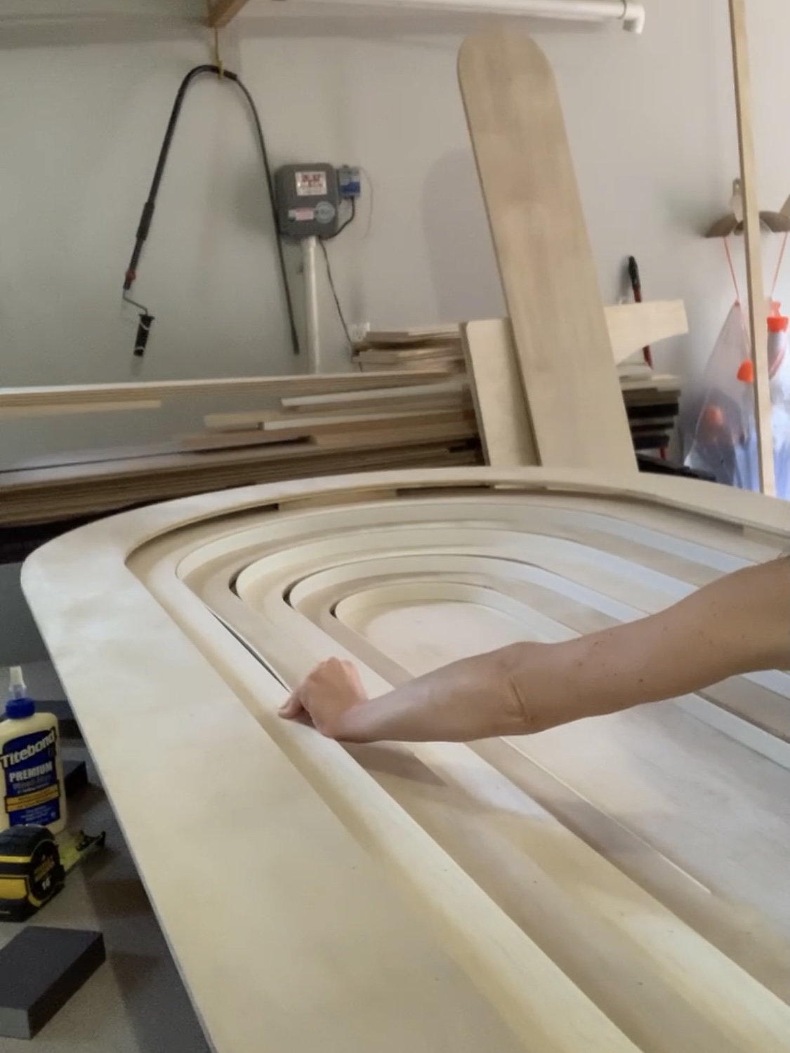 Dry-fitting a DIY Rainbow Headboard with bendable trim.